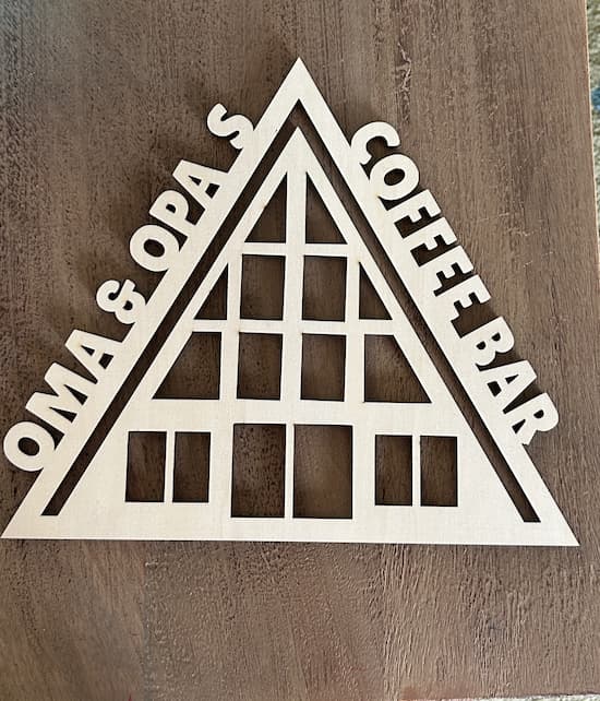 Oma and Opa's coffee bar sign on an a-frame house that has been laser cut