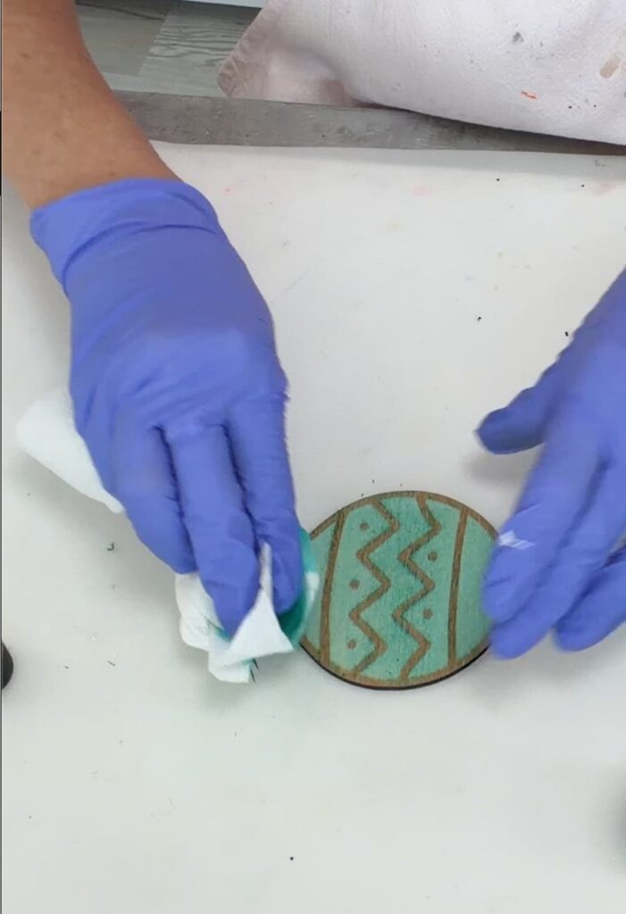 Laser engraver engraving the wood ornament