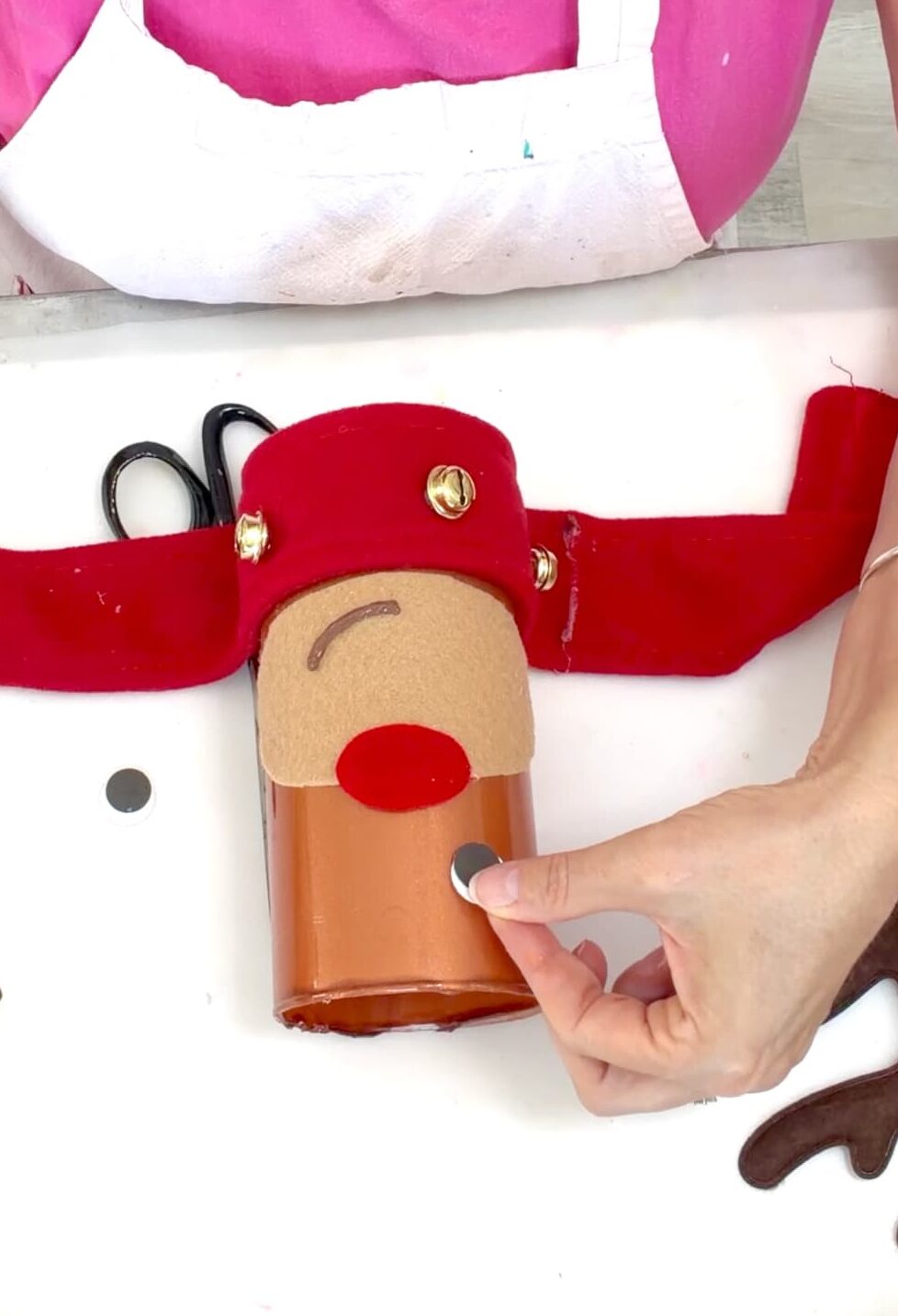 Putting together the face of the reindeer Christmas craft