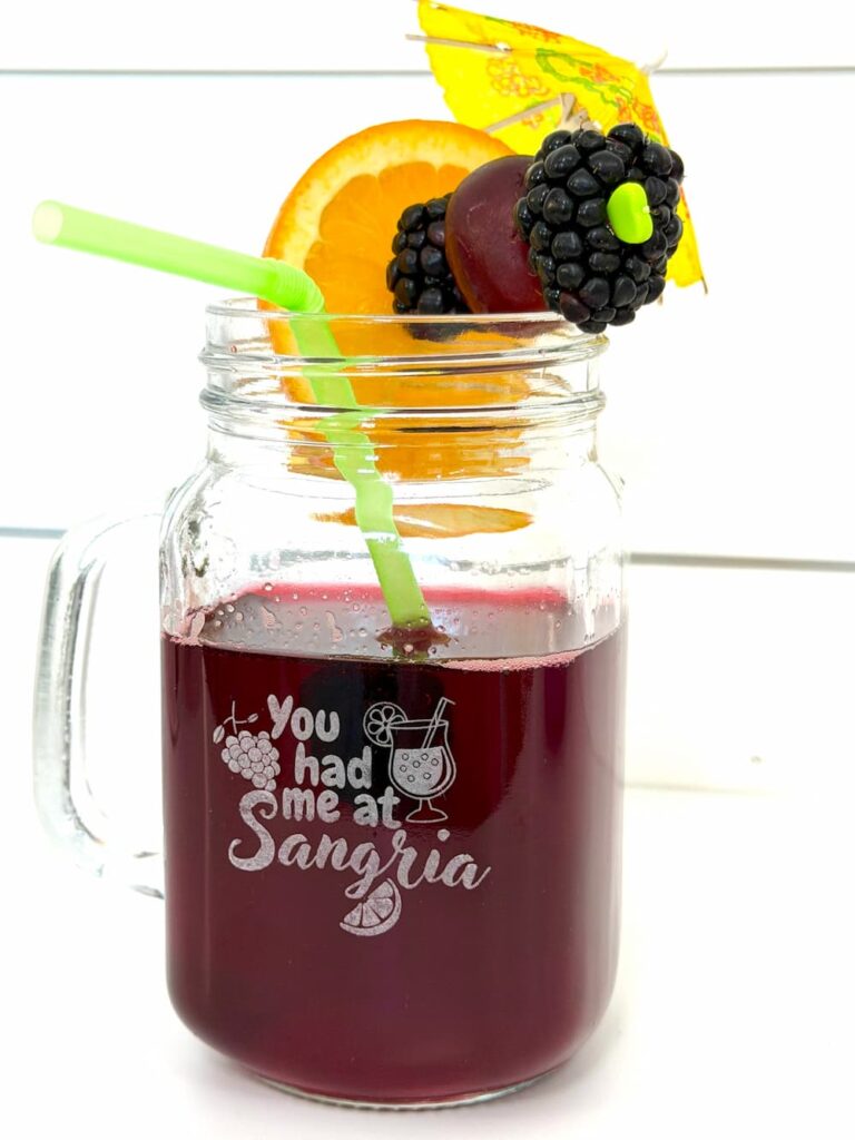 Finished laser engraving on glass and ended up with this sangria glass with orange slice, grape, blackberry and a green straw
