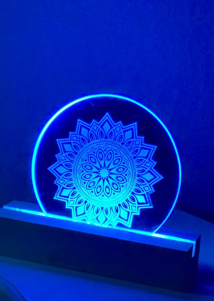 The final reveal on how to make a nightlight project with the mirror placed on an LED strip lit up blue