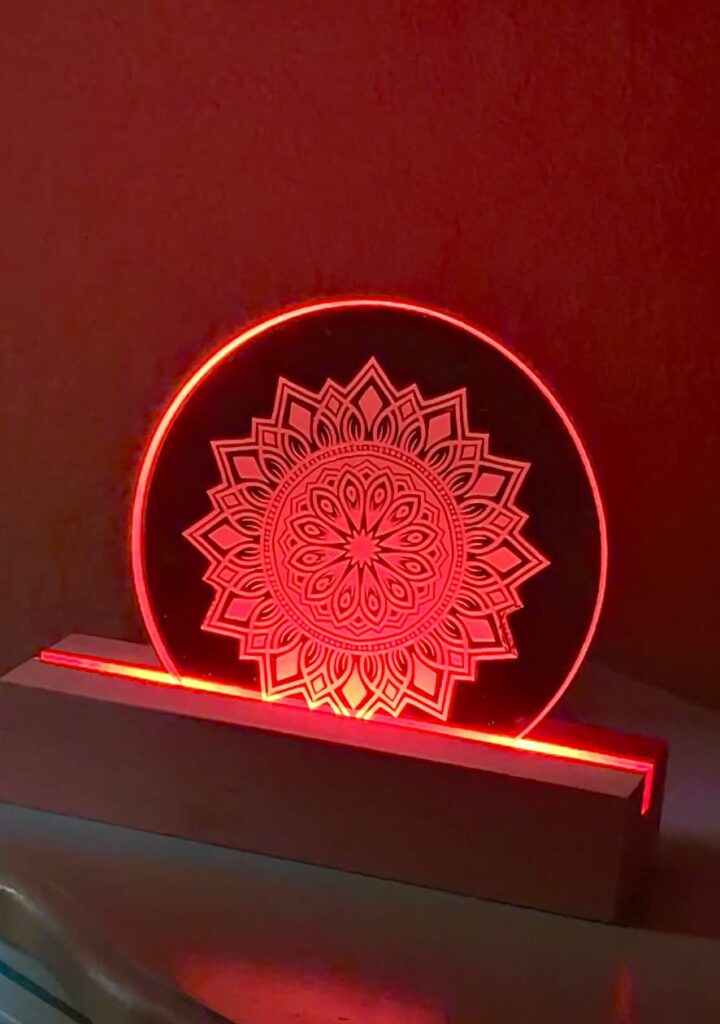The final reveal on how to make a nightlight project with the mirror placed on an LED strip lit up red