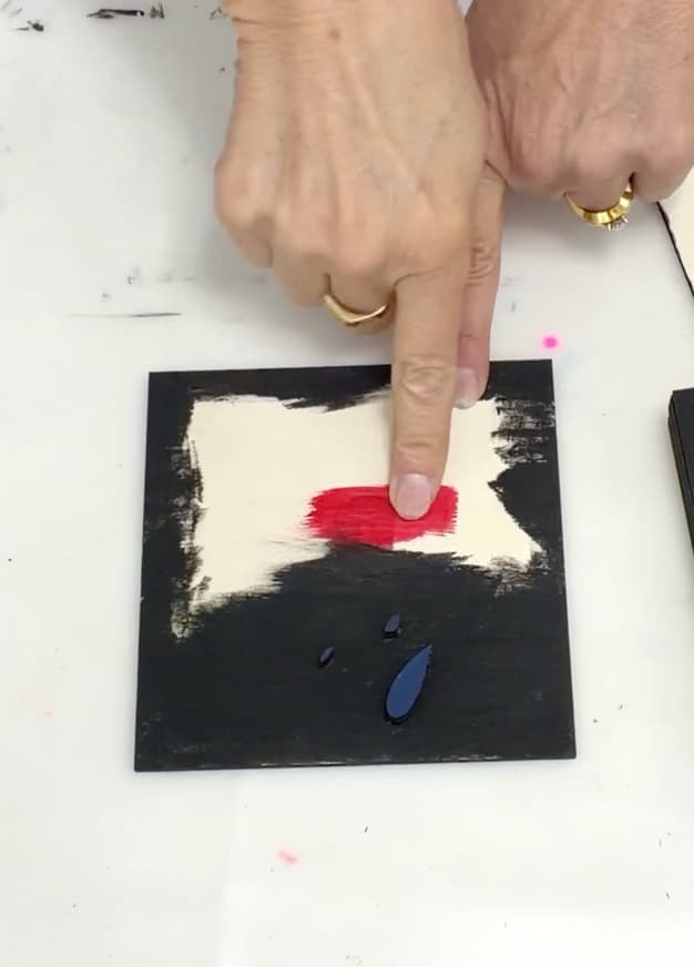 Wood block painted black, red and blue