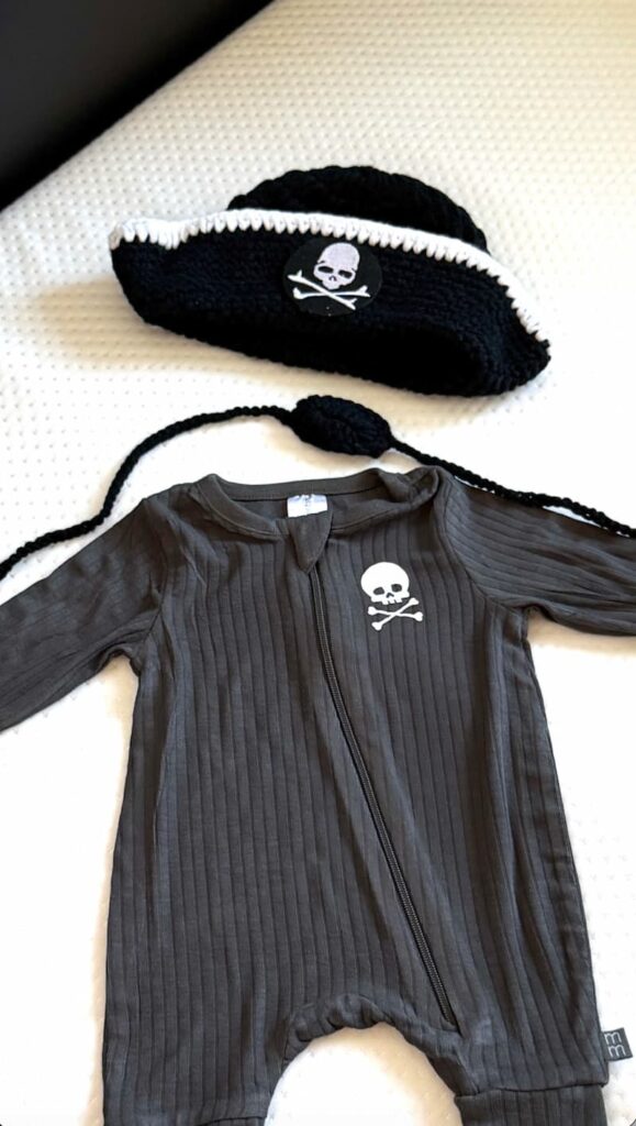 The final project when you use a Cricut to make a cute pirate onesie with a pirate hat and eye patch