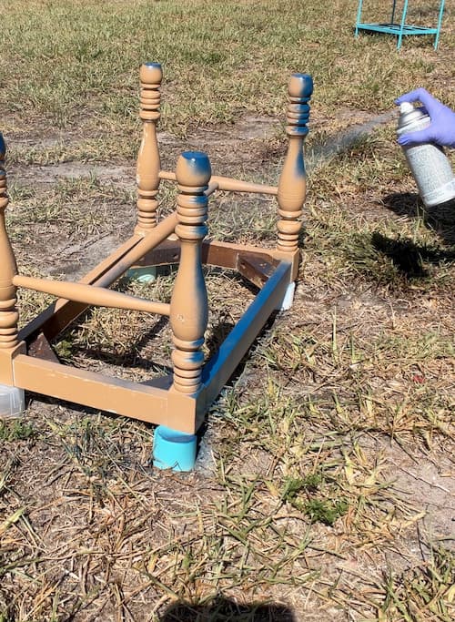 Painting the tan bench base blue before showing how to reupholster a bench