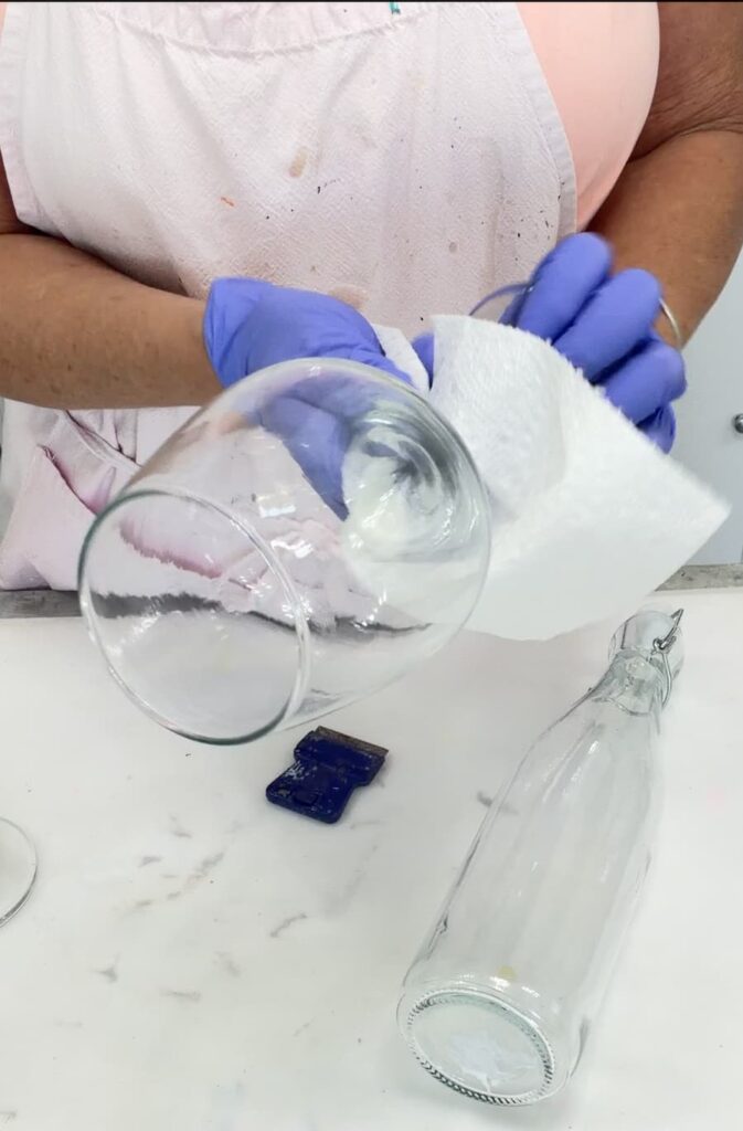 Cleaning a wine glass with a paper towel