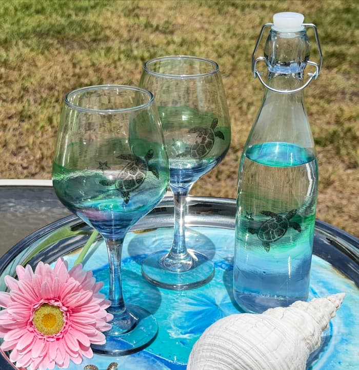 Finished coastal glass painting wine set on a tray