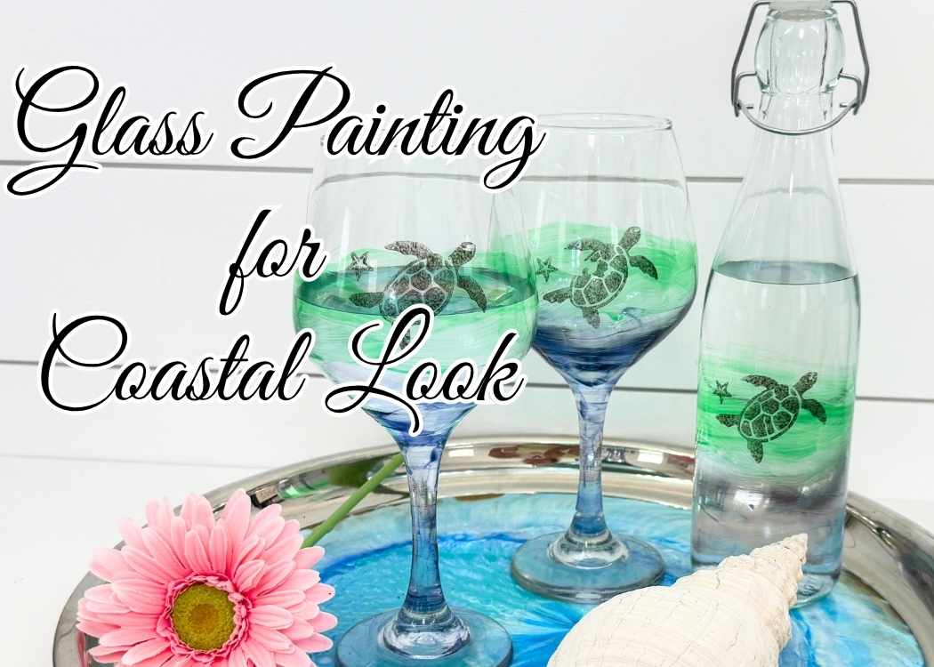 Coastal wine glass set and bottle on tray with a pink flower