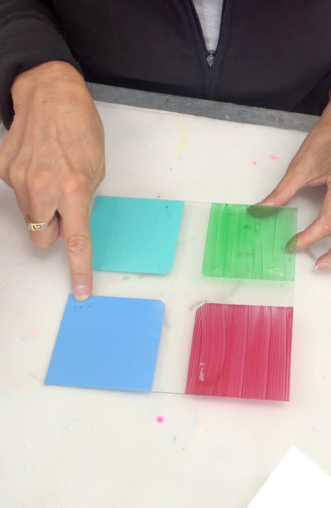pointing at the FolkArt Multi surface paint as the best glass paint