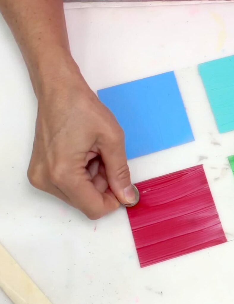using a quarter to test for the best glass a paint by scraping the paint
