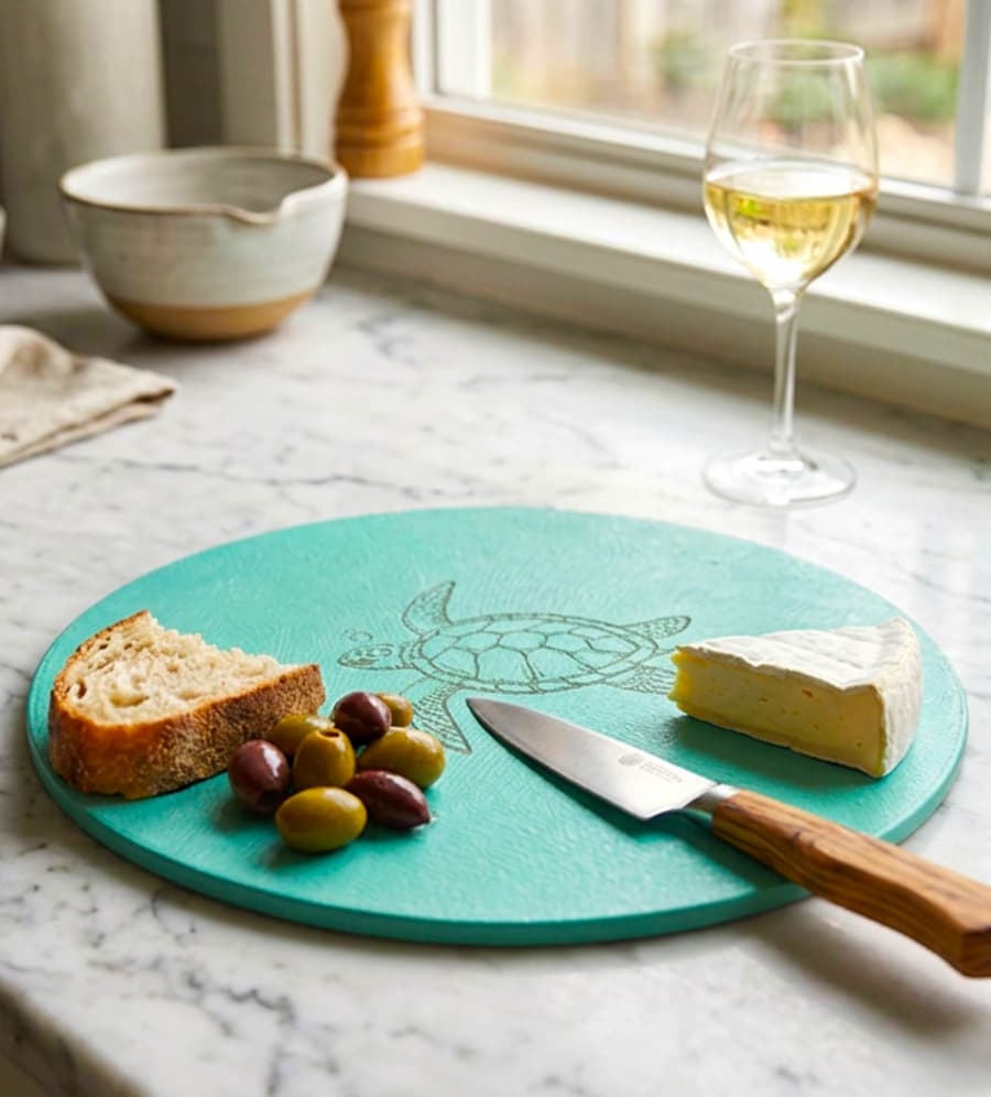 Turtle dollar tree cutting board with olives, bread and a glass of wine