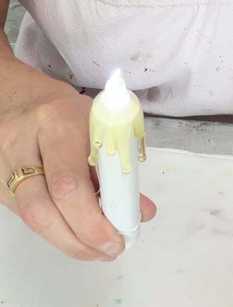 Candle with hot glue drips for the ghost mirror craft