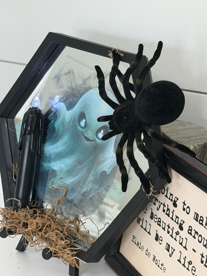 Dollar Tree mirror turned into a ghost mirror with a spider easy halloween craft