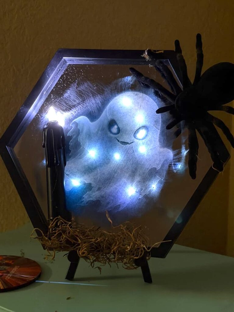 Finished Dollar Tree mirror turned into a spooky Halloween light up decoration