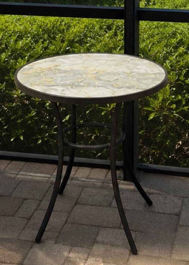 Round table sitting on a patio with glass top