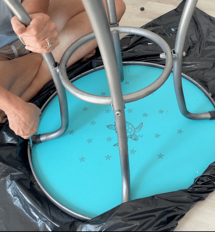 Putting the table base back onto the table