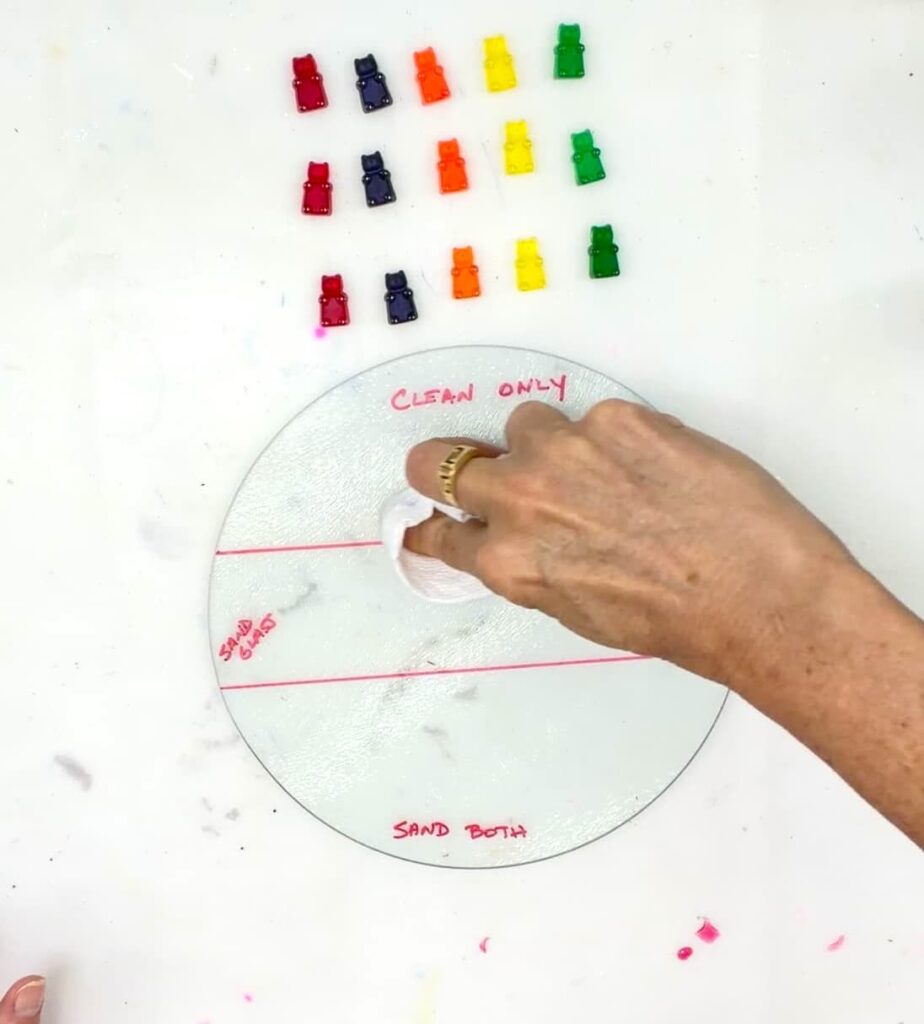 Setting up the experiment with resin gummy bears and a dollar tree glass cutting board, to determine the best glue for glass