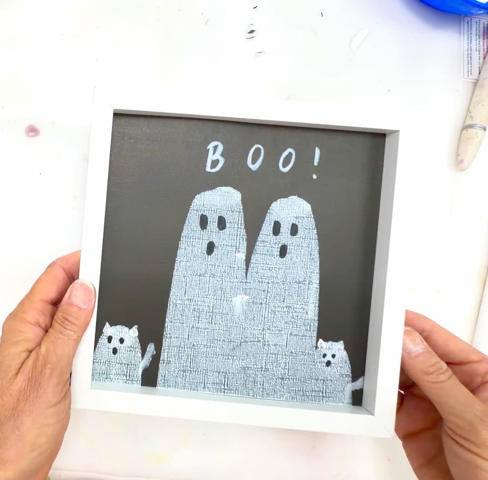 easy painting idea finished ghost art in a white frame with boo written over it